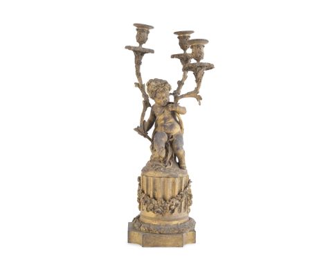 A FRENCH THREE LIGTH GILT METAL CANDLEABRA, 19th century, cast as a cherub holding three scrolling branches ending with light