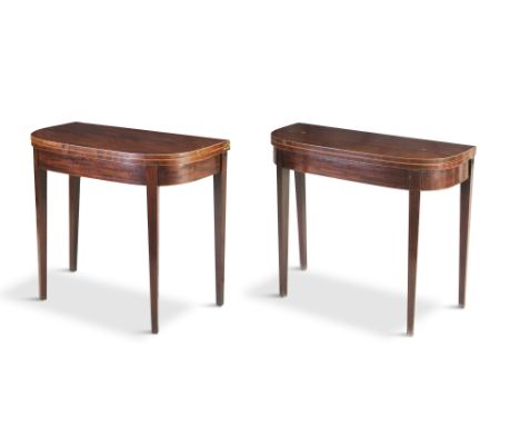 A PAIR OF EARLY 19TH CENTURY INLAID MAHOGANY SHAPED RECTANGULAR FOLDING TOP TEA TABLES, with boxwood stringing and raised on 