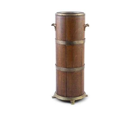 AN OAK AND BRASS BOUND CYLINDRICAL STICK STAND, late 19th century, fitted with twin handles, brass collar and base, with spla