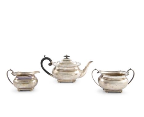 A GEORGIAN STYLE THREE PIECE SILVER TEA SERVICE, Sheffield c.1933, maker's mark of Harrison Brothers &amp; Howson, comprising