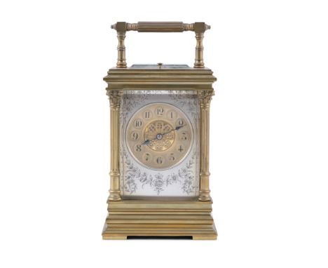 A FRENCH GILT BRASS TRAVEL CLOCK, 19th century, in original fitted case, surmounted with reeded swing handle, over a silvered