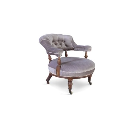 A VICTORIAN MAHOGANY FRAMED BUTTON BACK TUB ARMCHAIR, upholstered in grey with padded armrests, circular cushioned seat on sh
