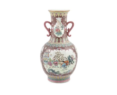 A LARGE DECORATIVE FAMILLE ROSE VASE, China, 20th century, of baluster shape with flared rim and looped side handles, painted