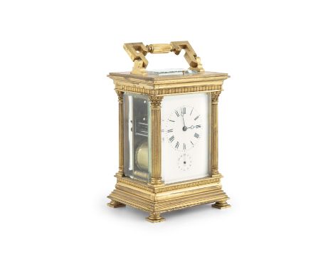 A 19TH CENTURY FRENCH GILT METAL CARRIAGE CLOCK, the rectangular case surmounted by a swing handle, the white enamel dial wit