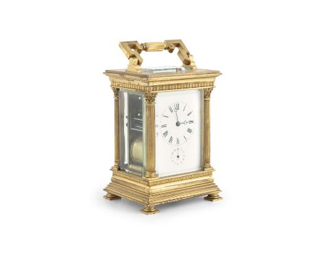 A 19TH CENTURY FRENCH GILT METAL CARRIAGE CLOCK, the rectangular case surmounted by a swing handle, the white enamel dial wit