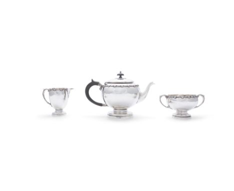 AN IRISH THREE PIECE SILVER TEA SERVICE, Dublin 1921, maker's mark of West &amp; son, comprising: teapot, sugar bowl and crea