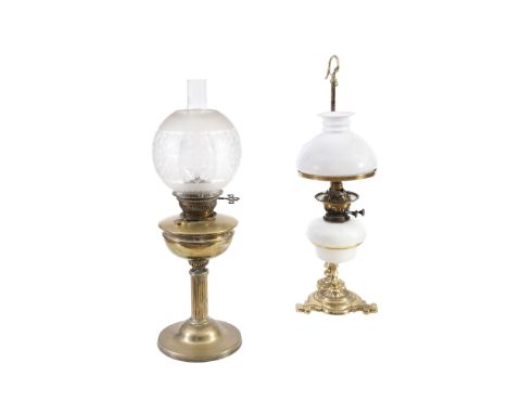 A LATE 19TH CENTURY BRASS OIL LAMP, with reeded column on circular platform base and with etched glass globular shade. 60cm h