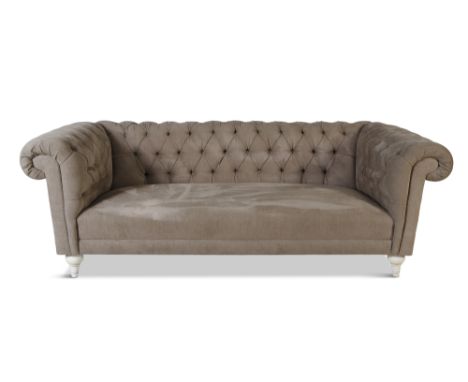 A BUTTON BACK CHESTERFIELD SOFA, of typical form, upholstered in green fabric, raised on short turned tapered feet. 68cm high