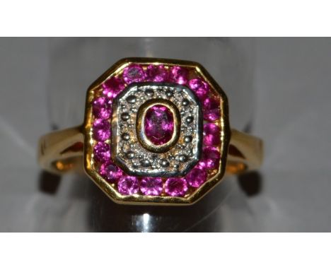 AN ART DECO DESIGN RUBY AND DIAMOND RING set in 18ct yellow gold.