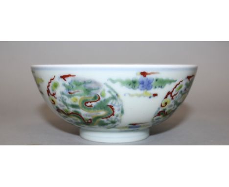 A CHINESE DOUCAI PORCELAIN DRAGON BOWL, the interior and the exterior sides decorated with dragon and cloud scroll roundels, 