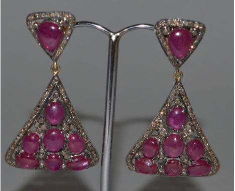 A PAIR OF DIAMOND AND RUBY DROP EARRINGS.