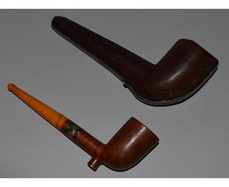 A WOODEN PIPE with amber mouthpiece, in a leather case.