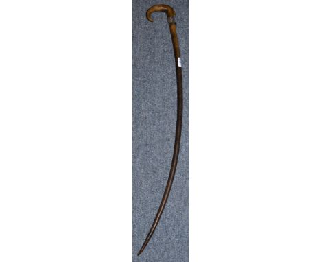 A CURVING RHINO WALKING STICK. 32ins long 475gms. Note: An export licence cannot be obtained for this item under current legi