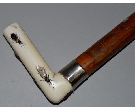 A SHIBAYAMA HANDLED WALKING STICK decorated with insects.