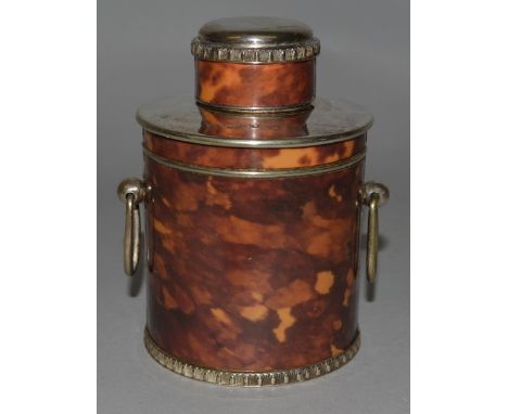 A SILVER PLATE AND TORTOISESHELL CIRCULAR TEA CADDY.