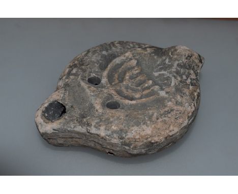 A ROMAN JEWISH TERRACOTTA OIL LAMP depicting The Seven Branch Menorah 4.25ins long, 3ins wide Possibly HAIFA, Circa. AD300 to