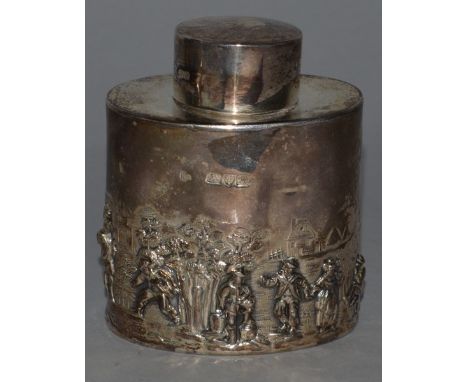 AN EDWARD VII OVAL TEA CADDY, repousse with figures Chester 1901.