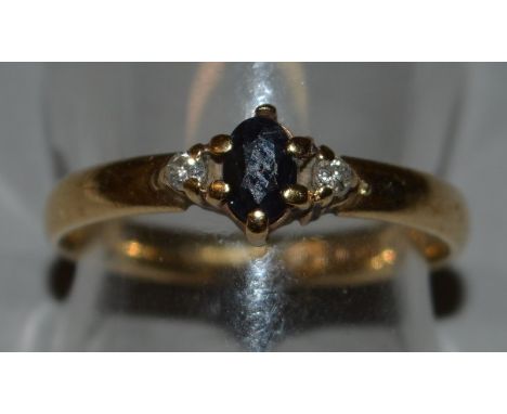 A 9CT GOLD, SAPPHIRE AND DIAMOND RING.