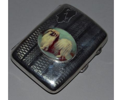 AN ENGINE TURNED SILVER CIGARETTE CASE, Birmingham 1923, with an oval of a dog.