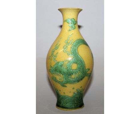 A CHINESE GREEN ENAMELLED YELLOW-GROUND PORCELAIN DRAGON VASE, decorated with a dragon amidst cloud scrolls above stylised wa