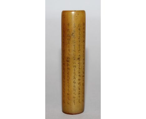 A CHINESE SOAPSTONE SEAL, the tall cylindrical body decorated with columns of calligraphy, 3.3in high.