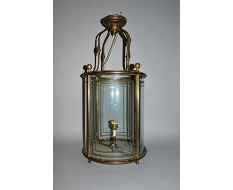 A GOOD 1920’S GILT METAL CIRCULAR LANTERN with curving supports, four frosted glass lined panels. 31ins high.