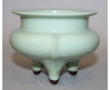 A CHINESE CELADON PORCELAIN TRIPOD CENSER, 4.1in diameter at rim & 3.25in high.