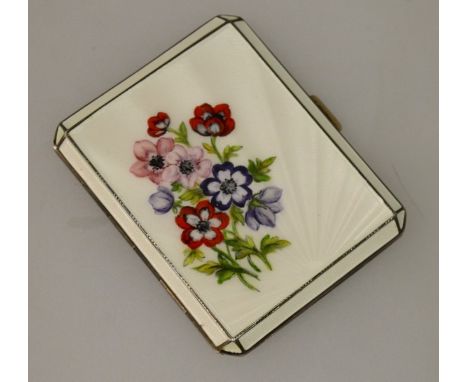 A GOOD ENGINE TURNED SILVER AND ENAMEL CIGARETTE CASE decorated with flowers Birmingham 1953.
