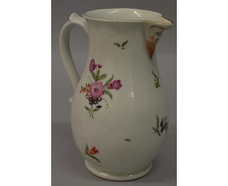 AN 18TH CENTURY WORCESTER MASK JUG painted with polychrome flowers.