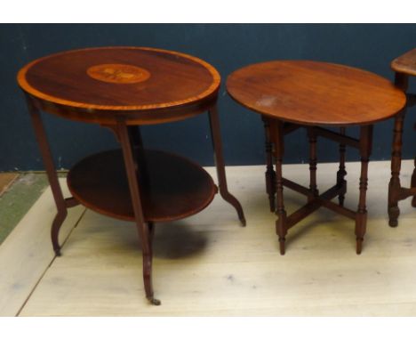 Edwardian mahogany cross banded & ebony line inlaid oval occasional table with under tier, the top inlaid musical instruments