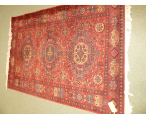 Modern Caucasian machine woven carpet, all over design on red ground 170x245