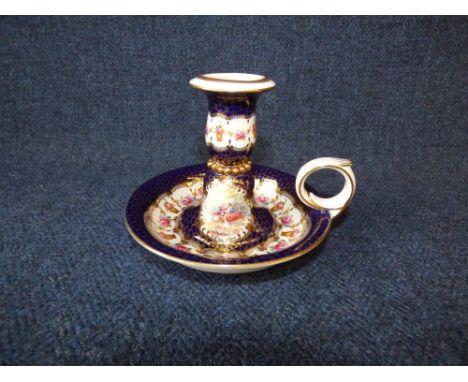 Sevres porcelain chamber candle stick, decorated with lovers and flowers and gilding, black Sevres mark, 10cmh