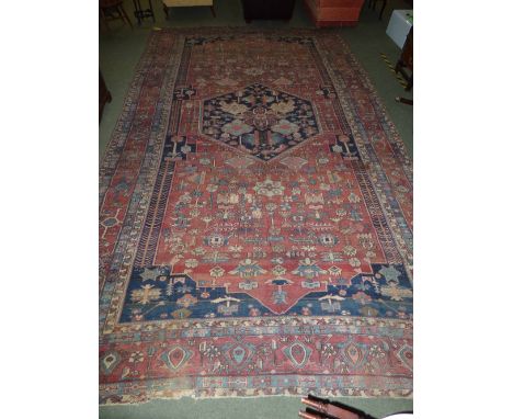 Large carpet with all over geometric patters and borders of browns, blues, creams &amp; greys 314x555 cm (PLEASE ASK FOR COND