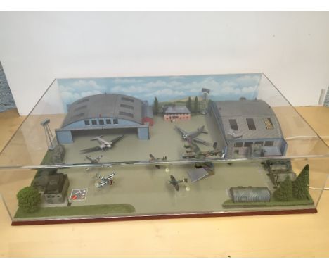 91.5 x 61 x 22cm, 1/144 scale Diorama of an airfield including 2 aircraft hangers, control tower & other buildings, 12 volt l