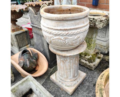 A Terracotta classical garden urn on stand, a terracotta planter, another smaller and a fish ornament&nbsp; &nbsp; 