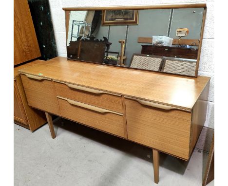 A mid 20th century light wood veneered sideboard in the G Plan manner with 2 central drawers and 2 cupboards, length 147cm 