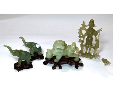 A Chinese jade coloured carved hardstone figure of a temple dog, other jade coloured carvings etc.&nbsp; Female deity figure 