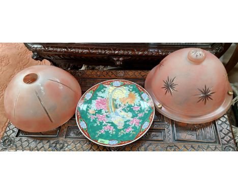 A Chinese green ground dish decorated with exotic birds and two ceiling light globes 