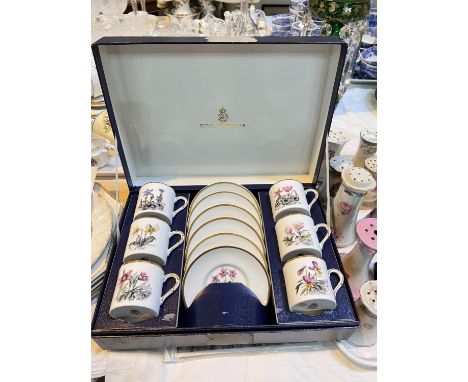 A boxed Royal Worcester coffee set, various botanic flowers 