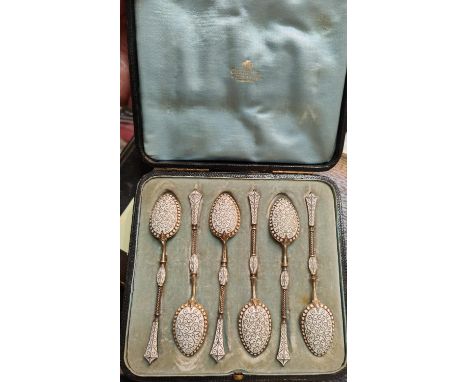 A set of 6 cased gilt and enamel spoons in the Russian manner, possibly Finnish, some bearing Birmingham import marks