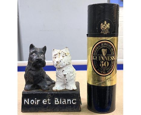 A French cast metal Noir et Blanc whiskey advertising stand, a framed reproduction Guinness poster and another Guinness item&