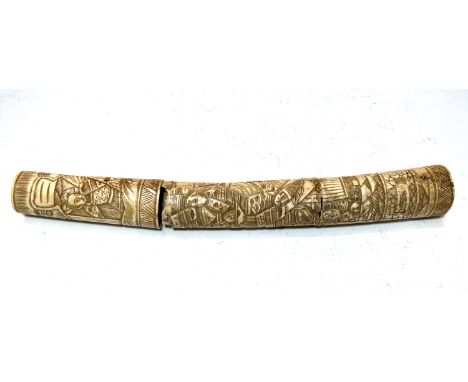 A Chinese bone dagger with extensively carved handle and scabbard (a.f.)&nbsp;With damage, see photographs.