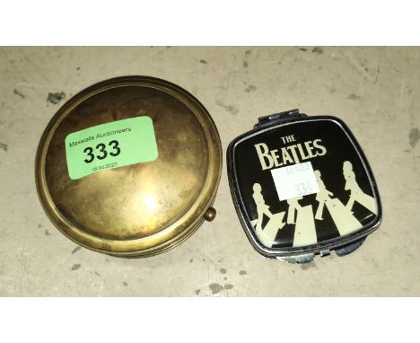 A Beatles Yellow Submarine brass compass; a Beatles Abbey Road compact 