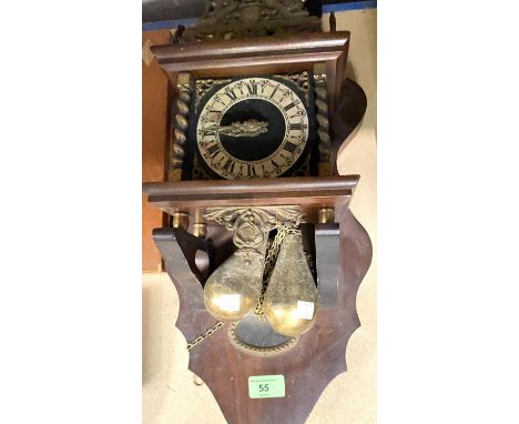 A reproduction wall hanging lantern clock with twin weights 