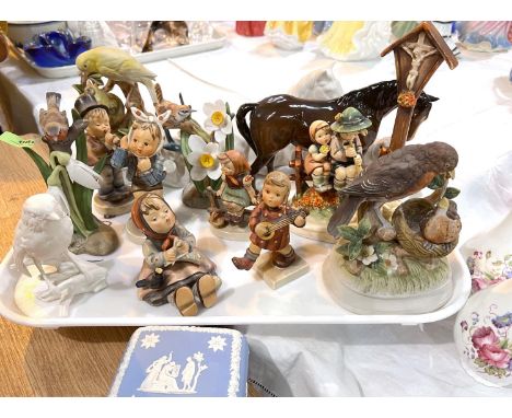 A selection of Hummel figures and other similar ceramics 