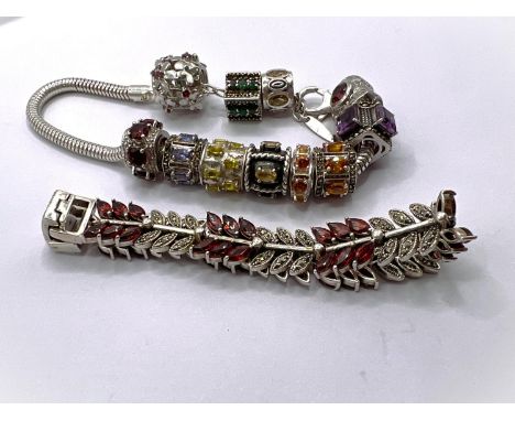 A silver '925' Pandora style silver bracelet with 11 charms, TGC&amp;C, a bracelet set with alternating bands of leaves set w