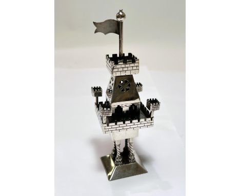 An unusual Israeli white metal item in the form of castle on stand with turrets and flag and four columns bellow, with hinged