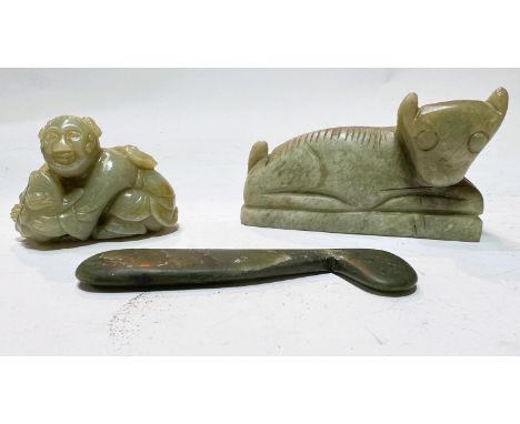 A Chinese jade coloured carving of a figure with a toad; two similar items.&nbsp; The larger carving is quite crudely execute