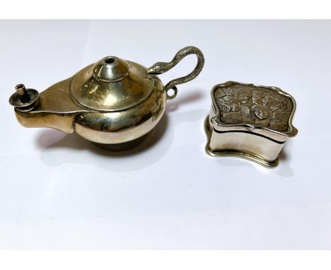 An "Aladdin's Lamp" hallmarked silver table lighter, Birmingham 1908, a shaped hallmarked silver trinket box with embossed ch