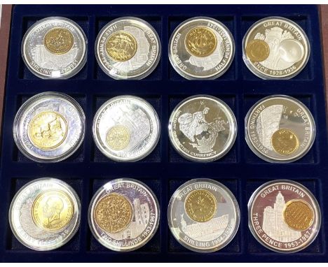 A pre-decimal set of gilt coins placed in silver plated medals with denominations of farthing to half-crown (12 coins total) 